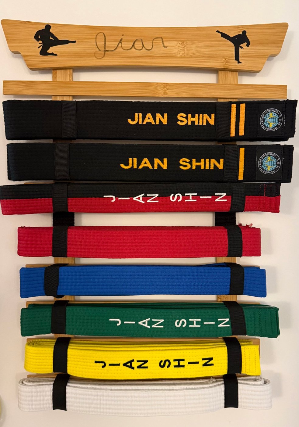 Jian's belts from white to 2nd Dan black belt