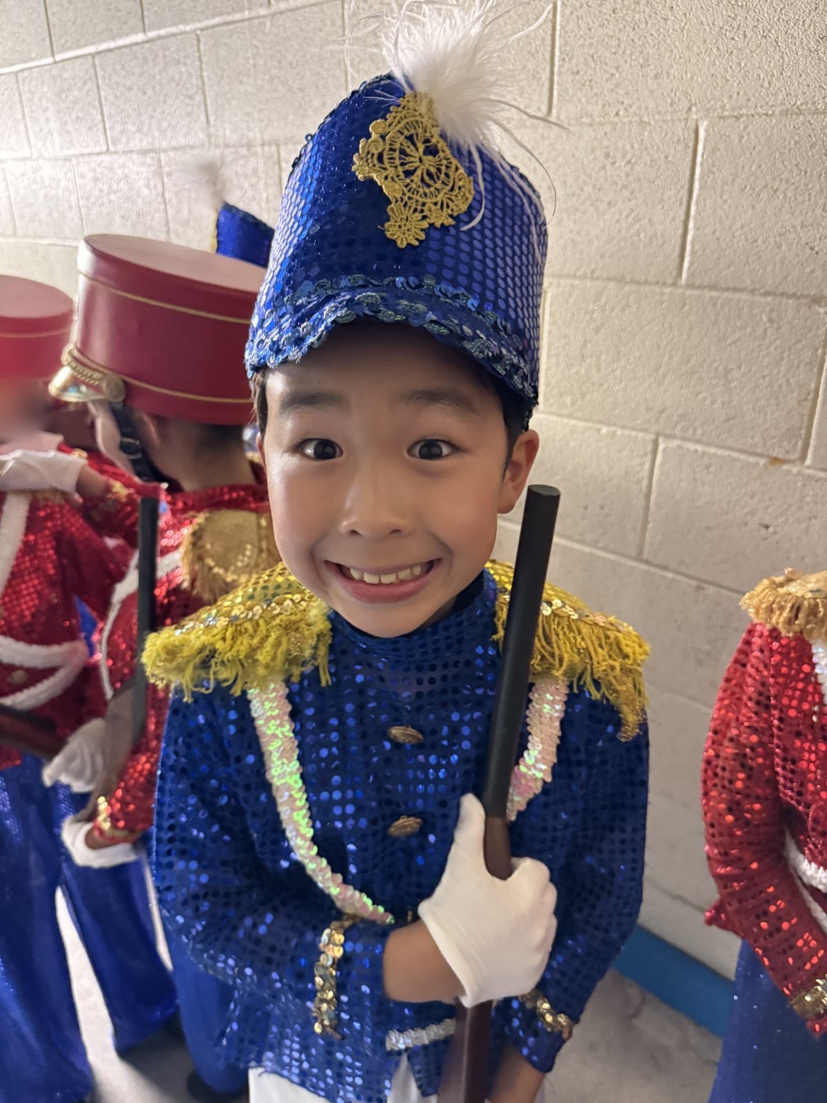 Jian backstage in a blue Soldier costume, 2023